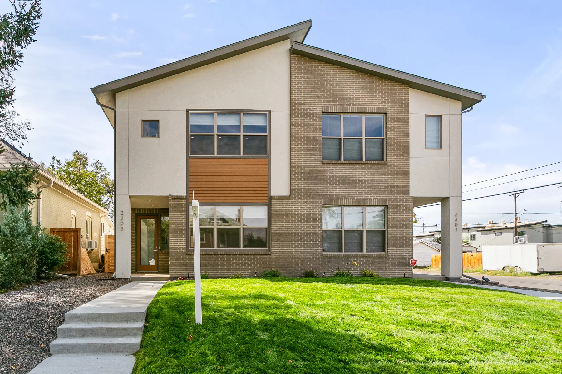 Modern two-story house with green lawn