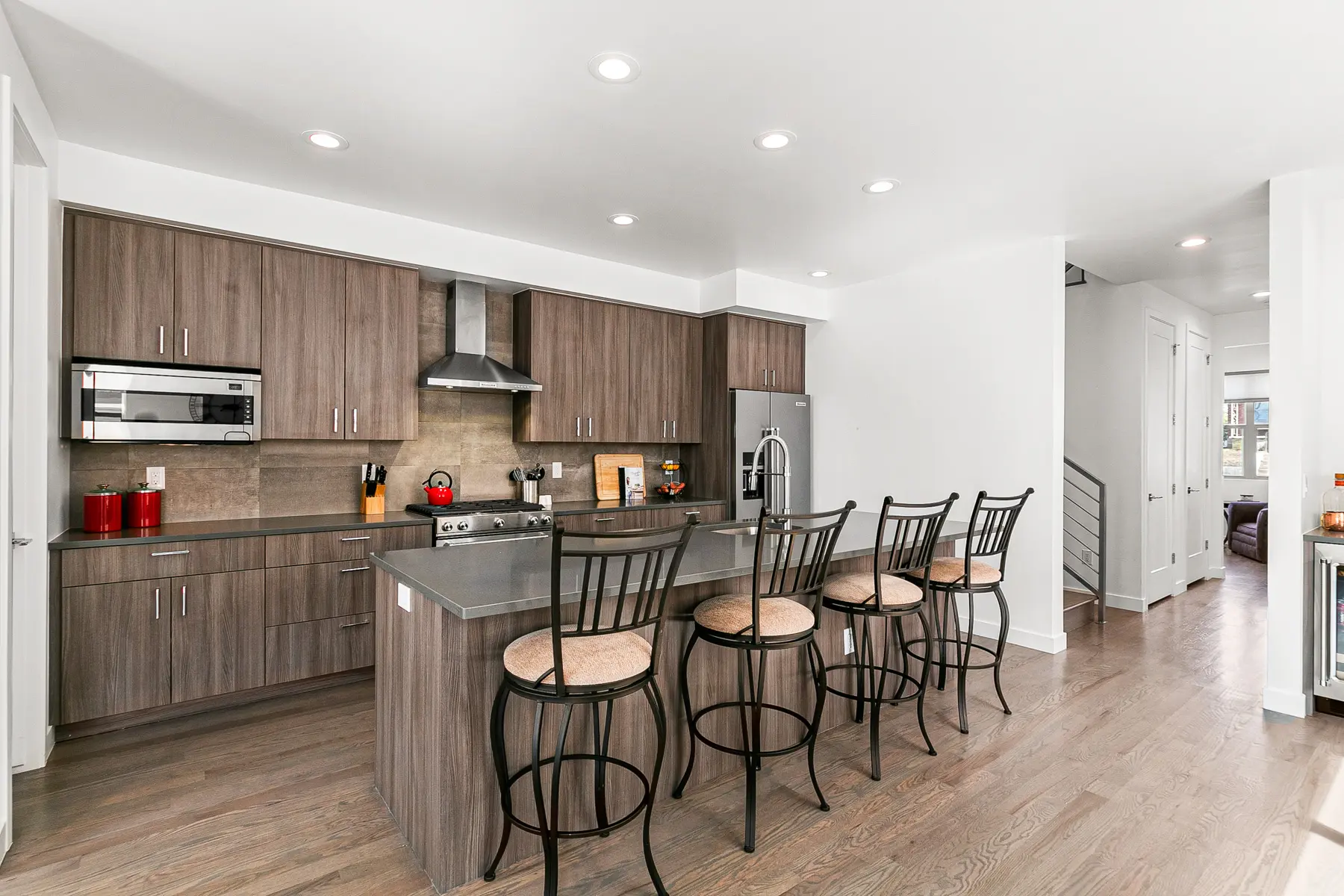 Modern kitchen island with four bar stools