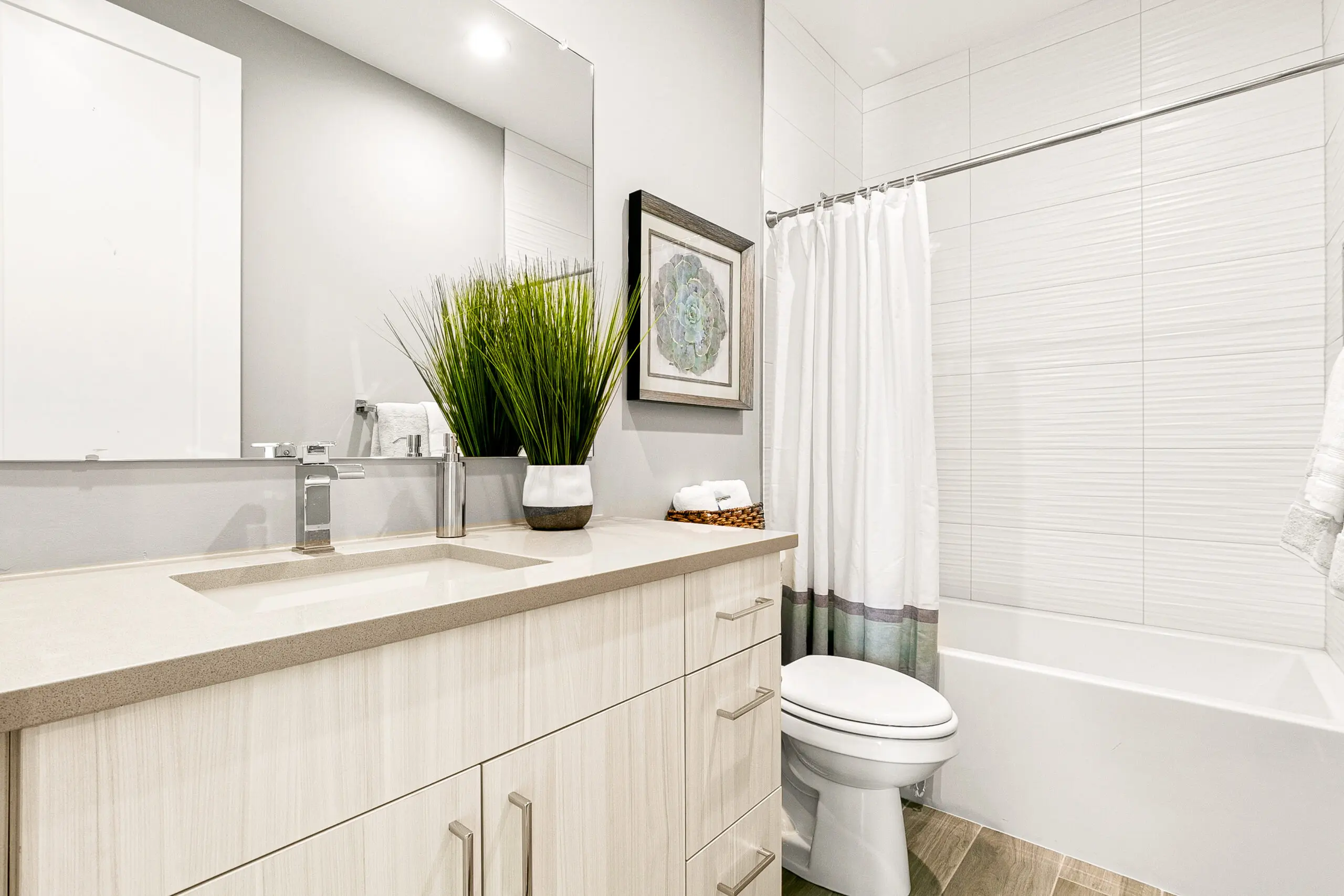 Bright modern bathroom with vanity and tub