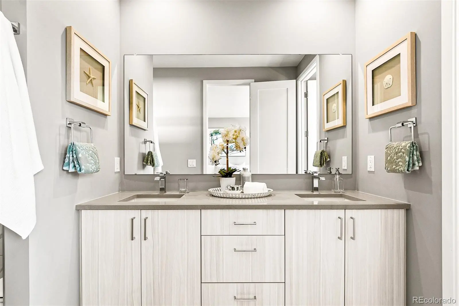 Contemporary light-wood double vanity with mirror