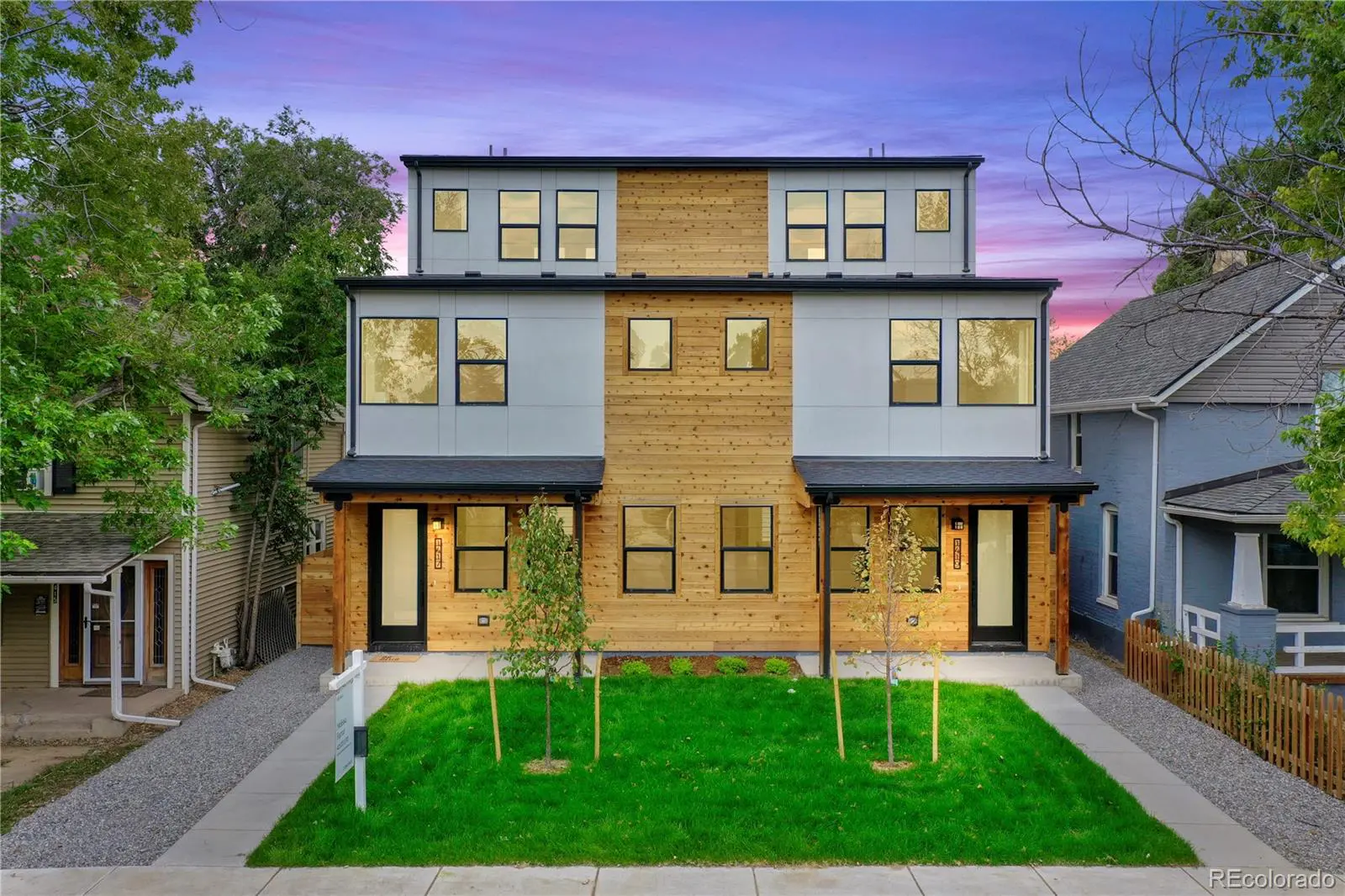Modern duplex with wood and gray facade